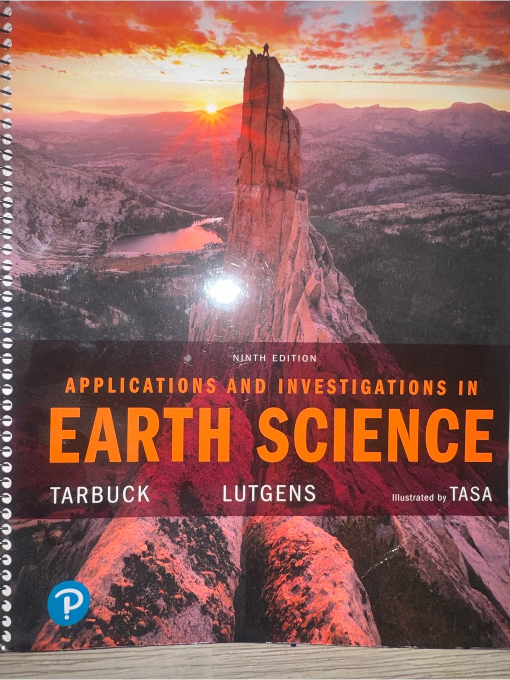 Pearson Earth Science Textbook Cover in Orange and Red Sunset Tones
